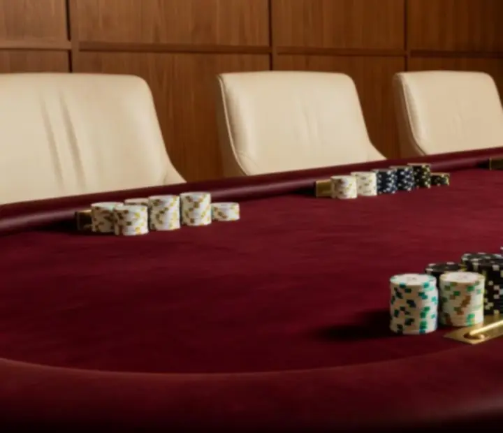 Premium full-size poker table with comfortable seating in a card room setting